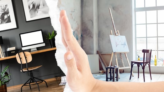 A white hand pushing away an office to reveal an art studio.