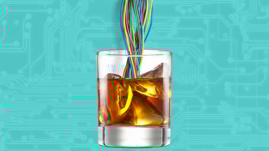  A cup of whiskey with wires being poured into it 