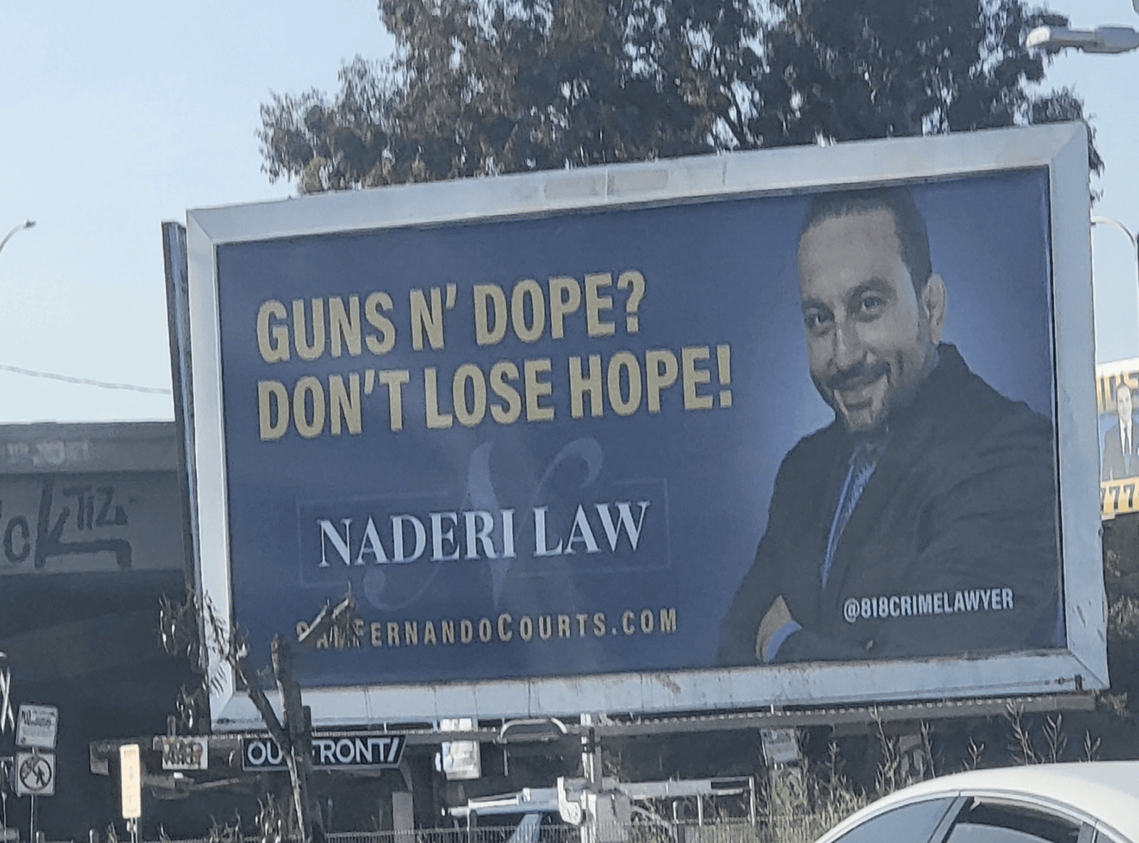 Lawyer_billboard_guns_dope