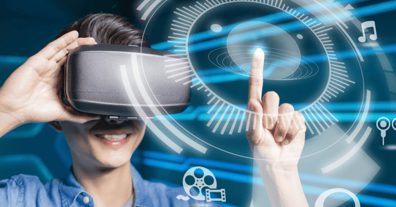 A person in a VR headset chooses entertainment options on a menu. 