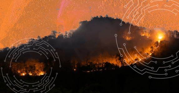 Wildfires burning on a mountain with an overlay of white geometric lines and circles. 